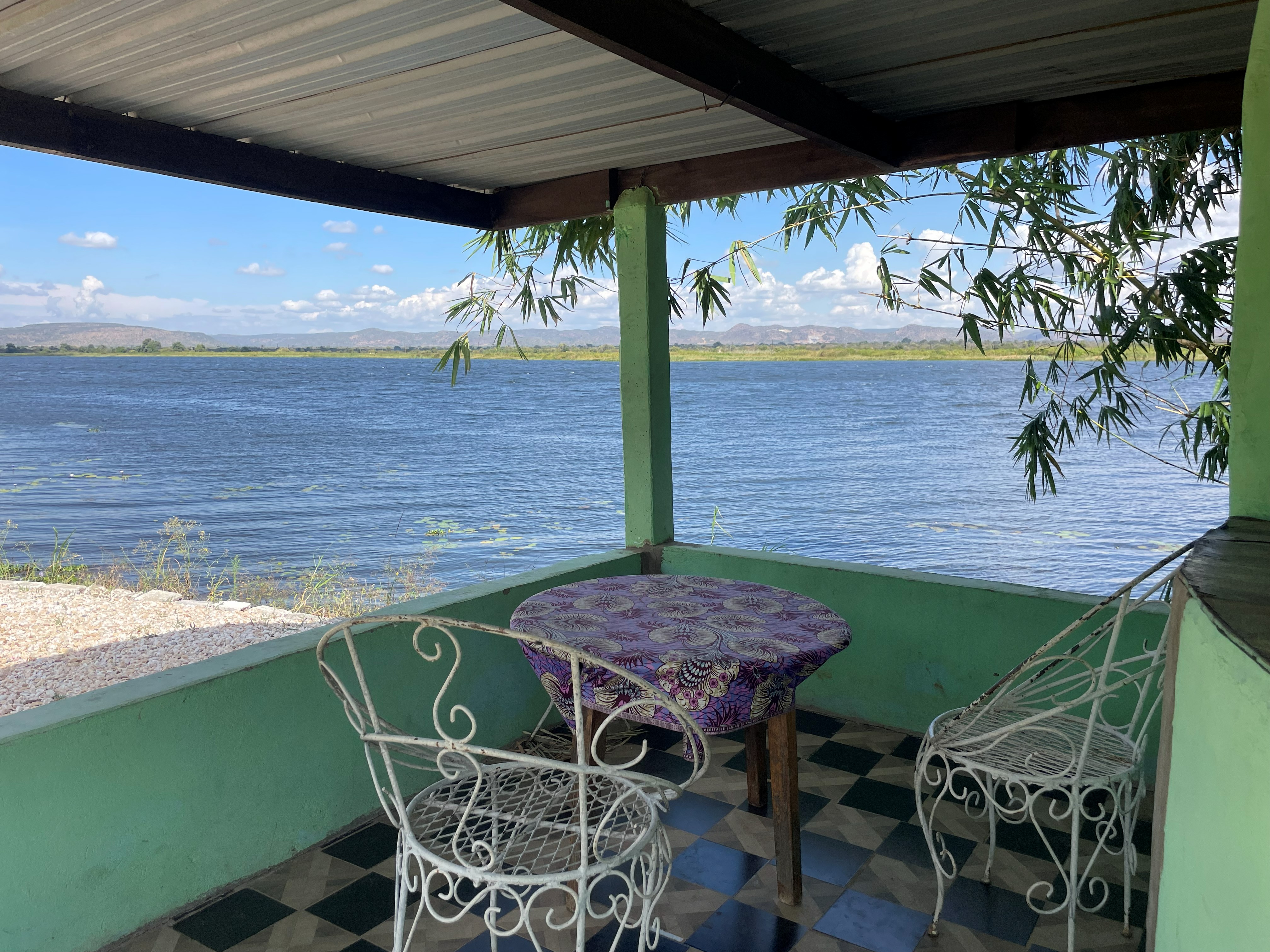 Sheltered camping spot with river view at Riverview Farm